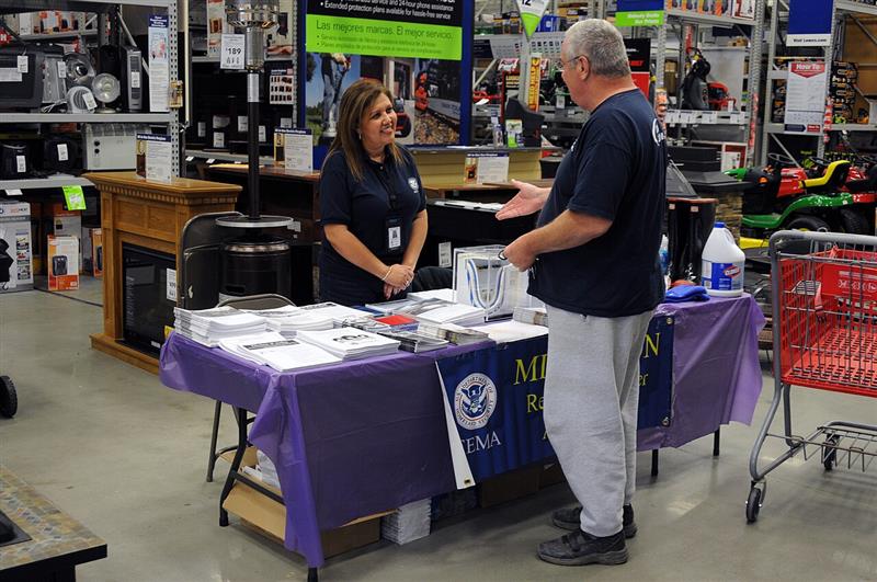 FEMA Hazard Mitigation Specialist reviewing flood risk mitigation and storm restoration guidance